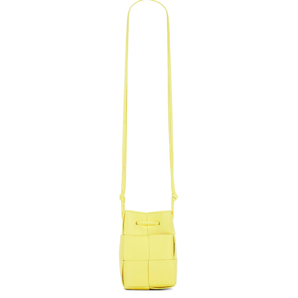 Chic woven mini crossbody bucket bag in white PU leather with adjustable 21-inch strap, light yellow