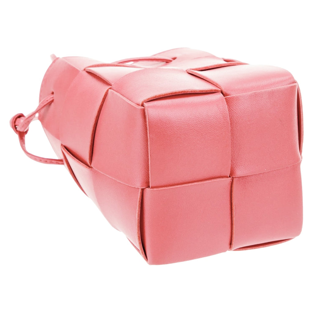 Lightweight leather woven mini bucket handbag in white with crossbody strap, pink