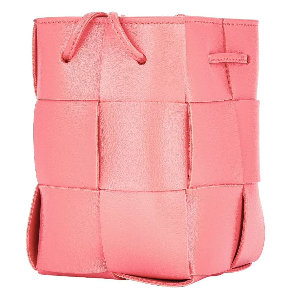 Lightweight leather woven mini bucket handbag in white with crossbody strap, pink