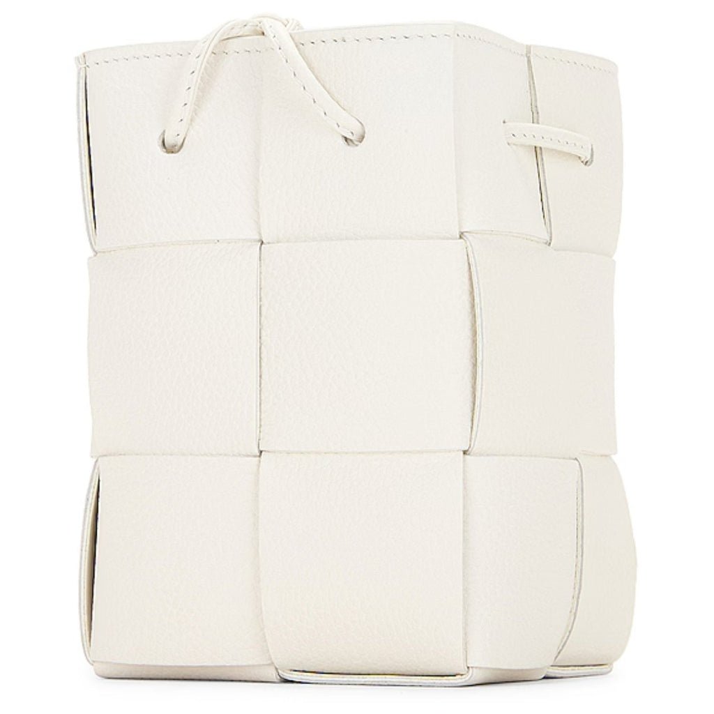 Lightweight leather woven mini bucket handbag in white with crossbody strap