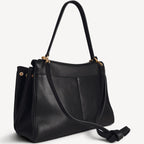 The Slouchy medium leather tote in black — back view
