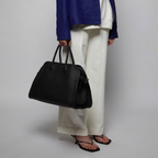 Belted 15 grained leather tote in black — model shot