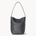 Vertical soft leather tote in black — front view