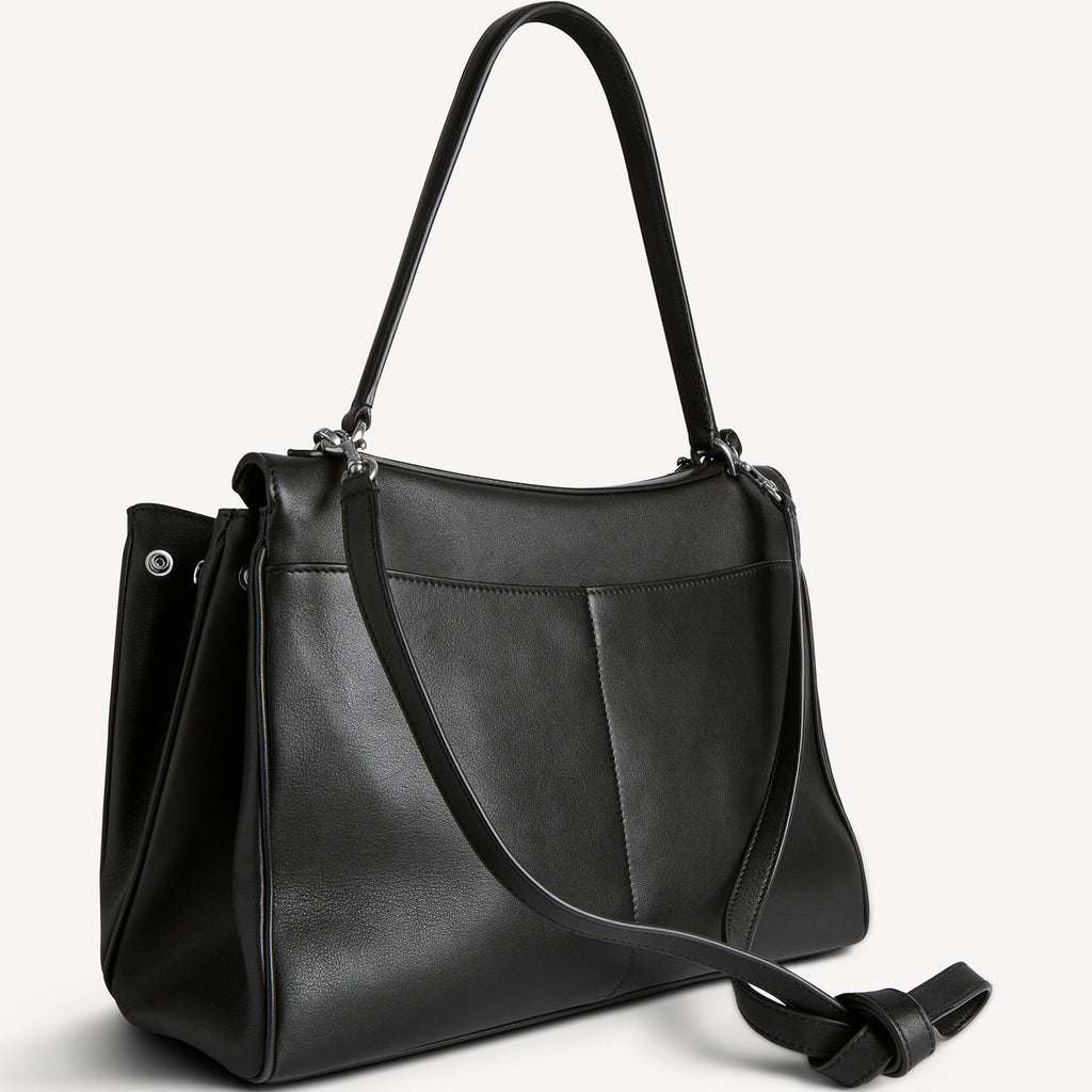 back view of chic black slouchy medium tote bag with polished silver hardware and a relaxed rectangular shape.