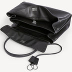 inside of chic black slouchy medium tote bag with polished silver hardware and a relaxed rectangular shape.