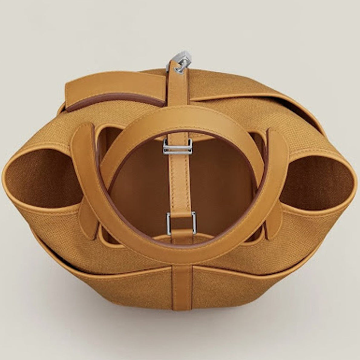 Sesame Beige bucket bag with canvas-style body, vegan leather trim, top-handle, lock strap, and utility side pockets