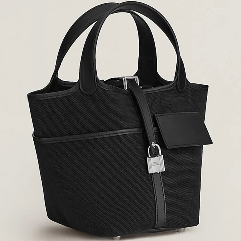Black canvas tote with silver hardware and side pockets