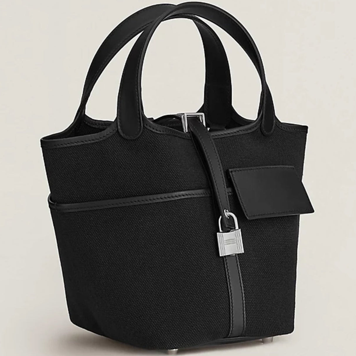 Black canvas tote with silver hardware and side pockets
