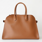 Brown structured tote bag made from premium PU, featuring a soft leather-like texture, minimal silhouette, and top handles – designed for modern, cruelty-free elegance.