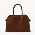 Front view of the Margaux 10 style suede tote bag in Coffee Brown with belted side details.