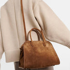 Belted 10 suede leather tote in coffee brown — model shot