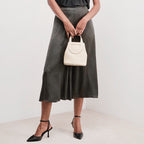 Compact Loop bucket bag in white — model shot