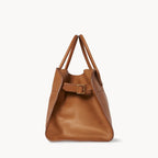 Brown structured tote bag made from premium PU, featuring a soft leather-like texture, minimal silhouette, and top handles – designed for modern, cruelty-free elegance.