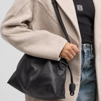 Close-Up of Knotted Drawstring Detail and Strap Hardware in Black Finish