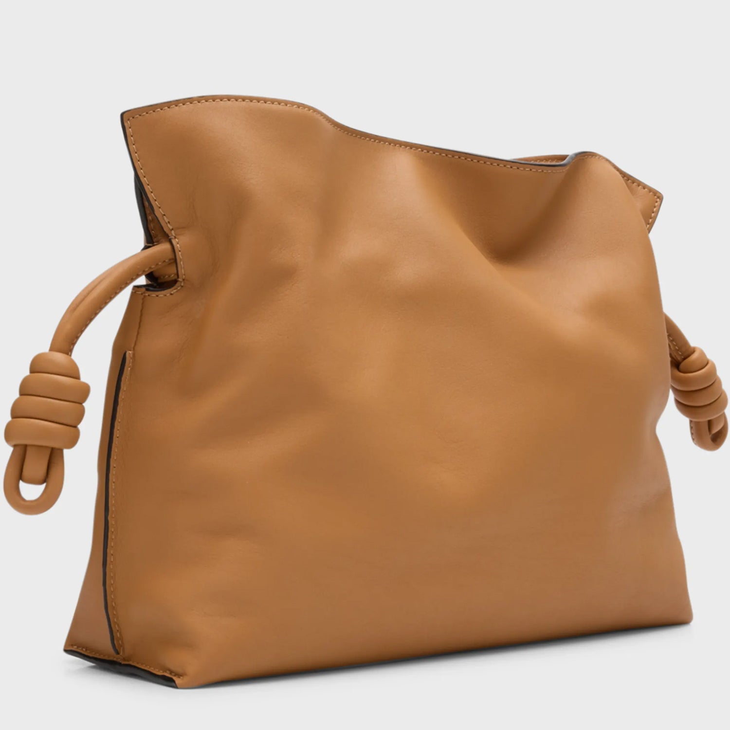 Side View of Slouchy Beige Leather Clutch with Adjustable Strap