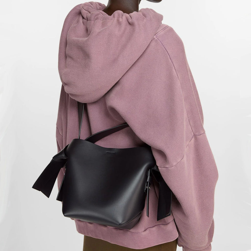 Black Mini Bag Styled with Crossbody Strap and Silver Hardware