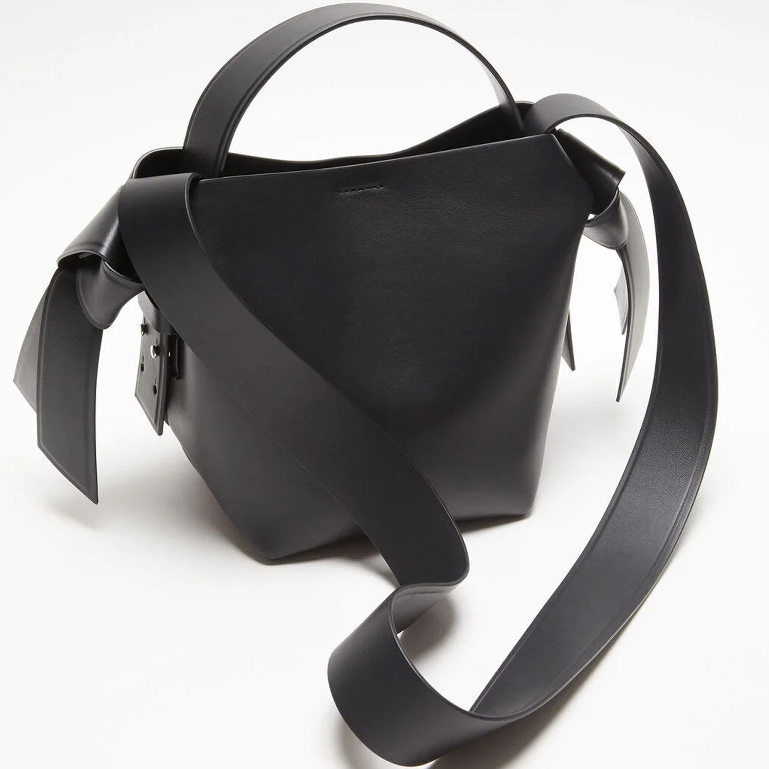 Side View of Black Knot Bag with Silver Adjustable Strap Attachments