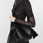 Black Mini Bag Styled with Crossbody Strap and Silver Hardware