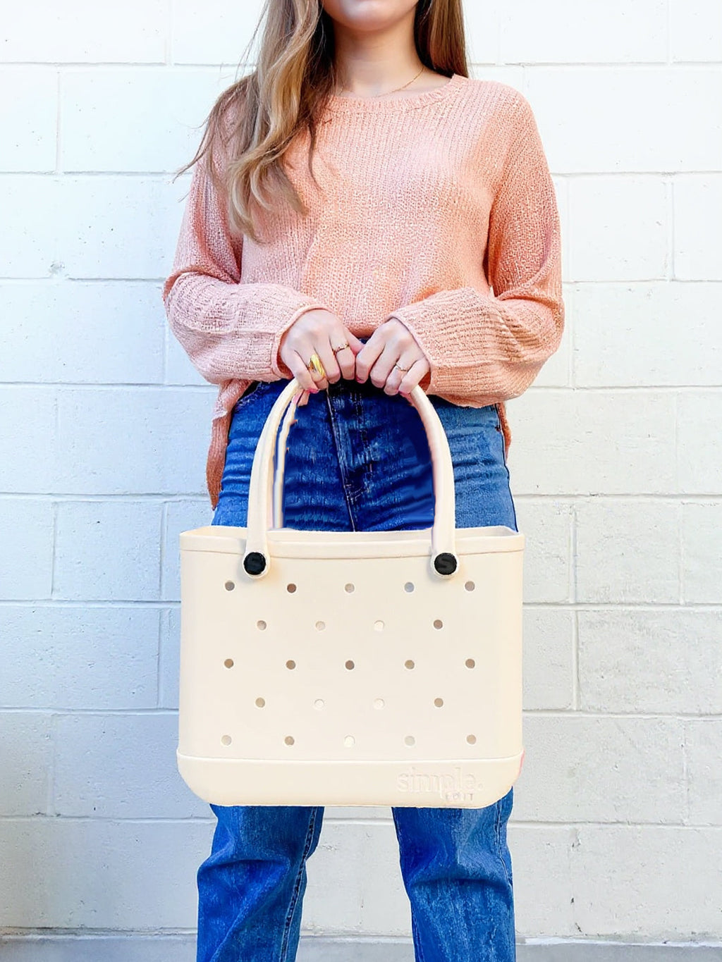 Medium EVA Tote in Coconut. Waterproof, rubber-like EVA bag in creamy ivory. Lightweight and versatile for errands, gym, and everyday use.