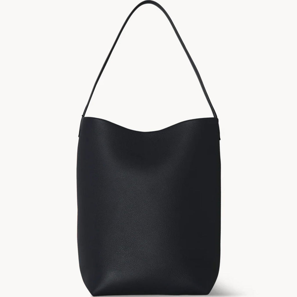 Black slouchy leather tote bag with minimalist silhouette