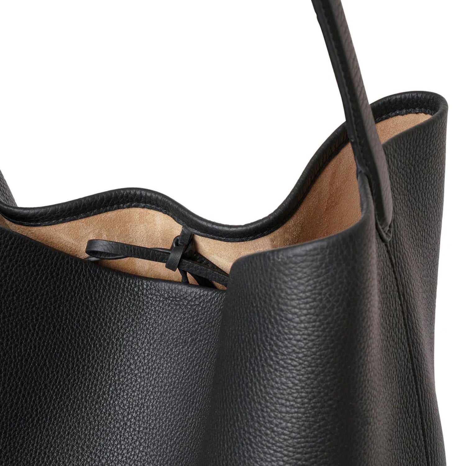 Black slouchy leather tote bag with minimalist silhouette