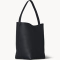 Black slouchy leather tote bag with minimalist silhouette