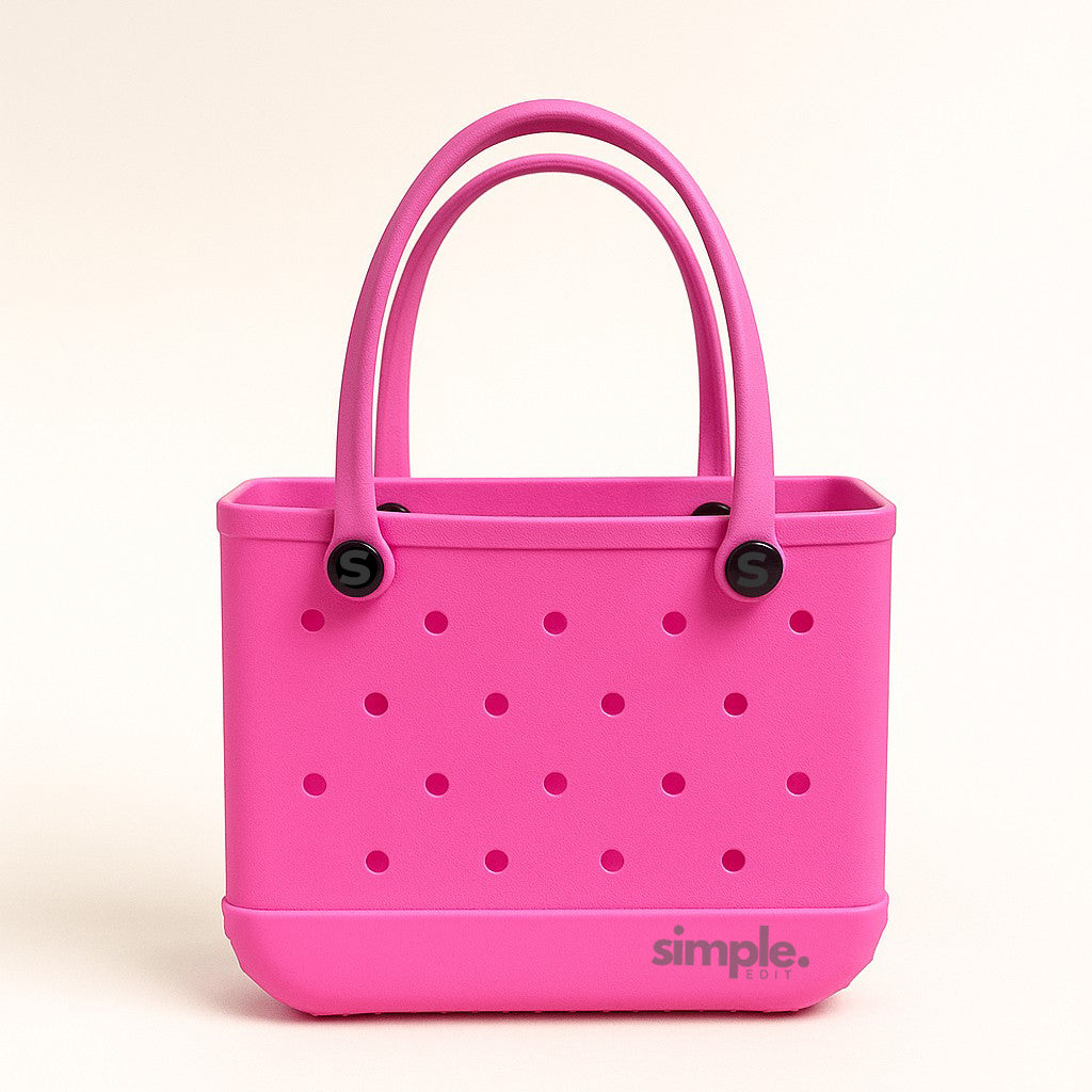 Small EVA Tote in Haute Pink. Vibrant waterproof mini tote made from rubber-like EVA. Compact, stylish, and easy to carry for everyday use.