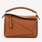 Sesame Beige bucket bag with canvas-style body, vegan leather trim, top-handle, lock strap, and utility side pockets