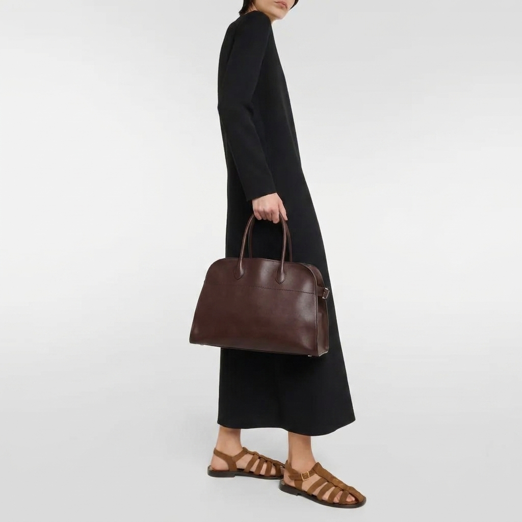 Mocha soft leather tote bag with toggle closure and side tabs model shot