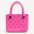 Small EVA Tote in Haute Pink. Vibrant waterproof mini tote made from rubber-like EVA. Compact, stylish, and easy to carry for everyday use.