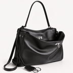chic black slouchy medium tote bag with polished silver hardware and a relaxed rectangular shape.