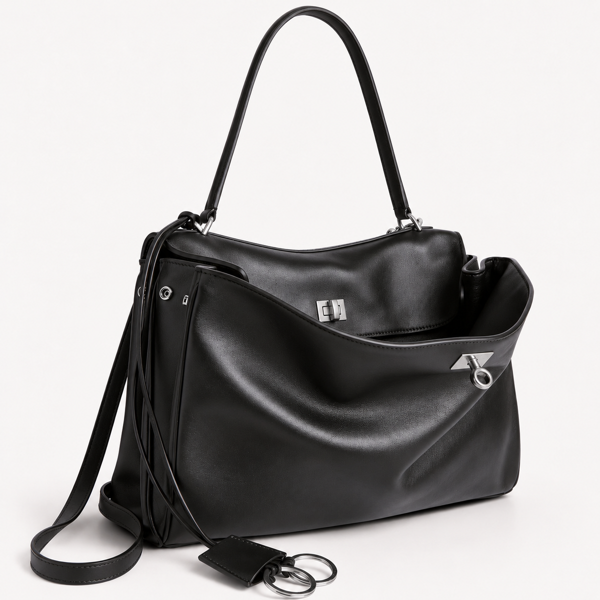 chic black slouchy medium tote bag with polished silver hardware and a relaxed rectangular shape.
