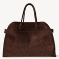 Front view of the large Margaux 15 style suede tote in Coffee Brown with signature belted sides.