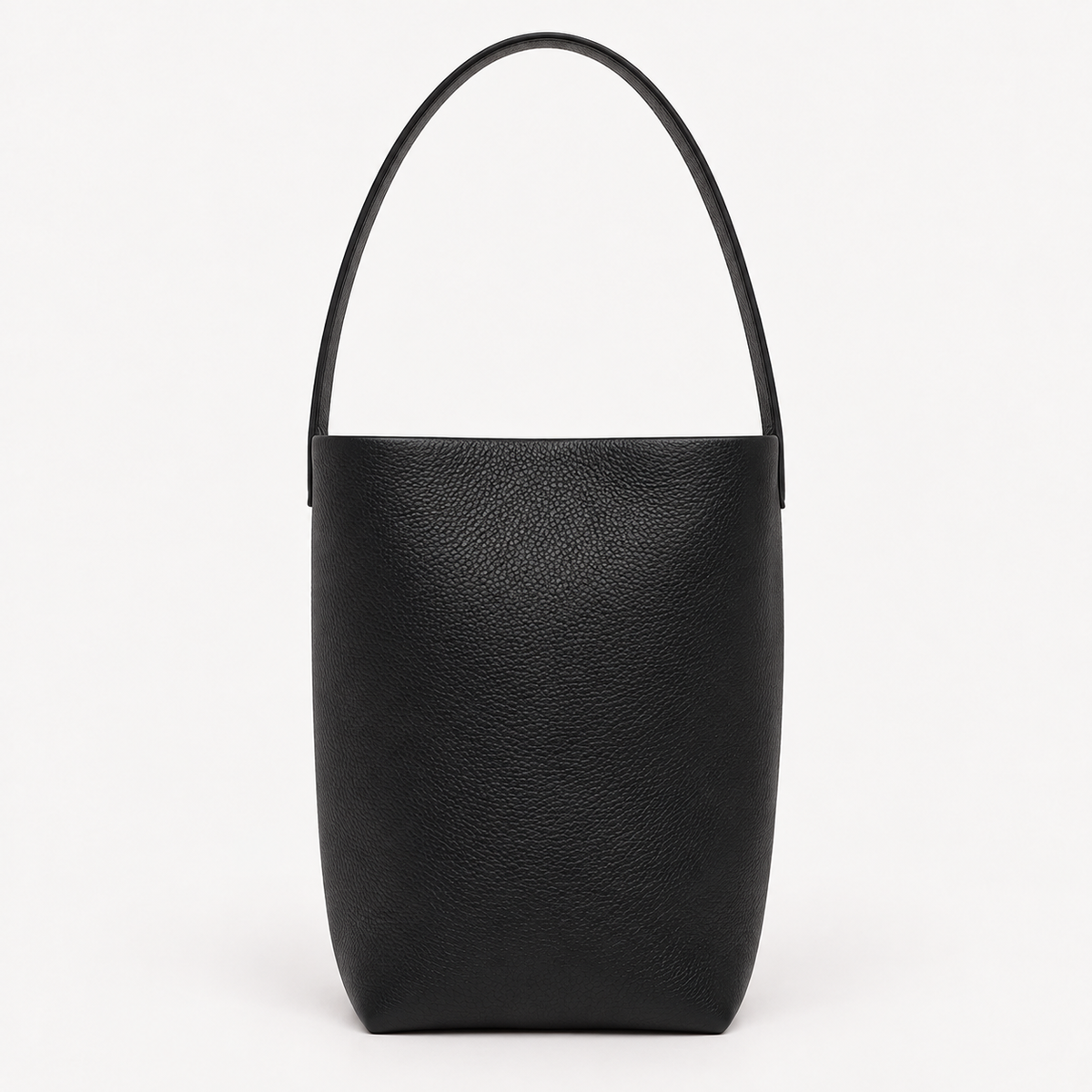 Vertical soft leather tote in black — front view showing natural grain