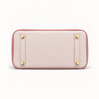 Classic 30 togo leather tote in contrast pink, base view with four protective feet