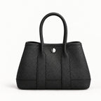 Weekday Tote Mini 23 cm open-top tote in black with silver-tone snap, front view