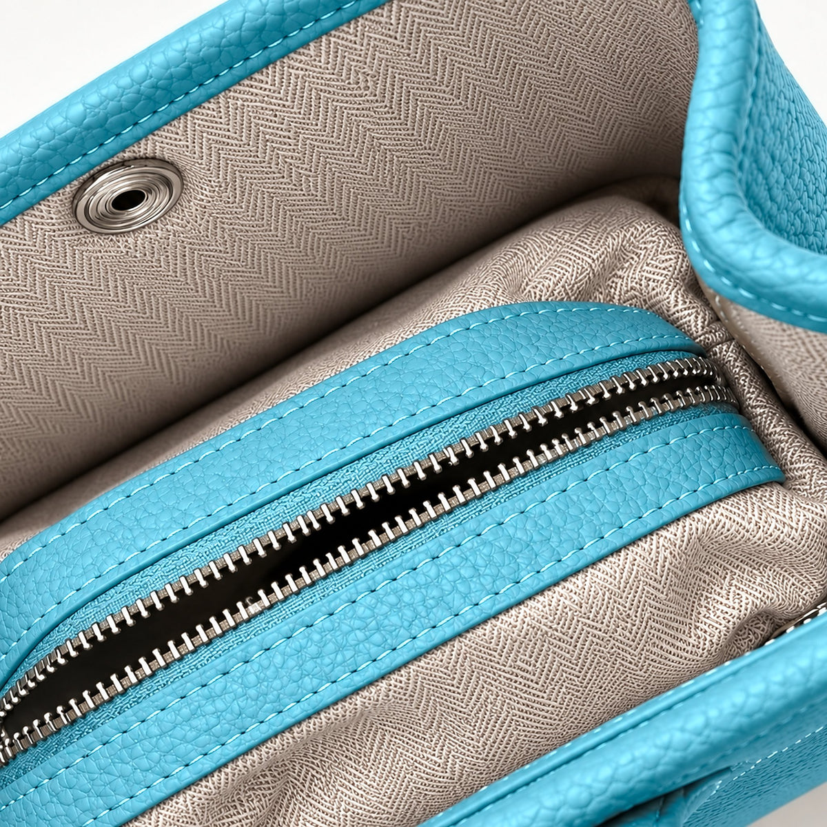 Weekday Tote Mini 23 cm open-top tote in sky blue, interior view with herringbone lining and zip pocket