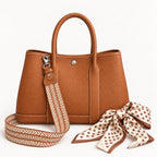 Weekday Tote Medium 30 cm open-top tote in brown with the included woven shoulder strap and twilly scarf