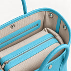 Weekday Tote Medium 30 cm open-top tote in sky blue, interior view with canvas lining and zip pocket